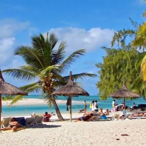 tourists relaxing in diani beach