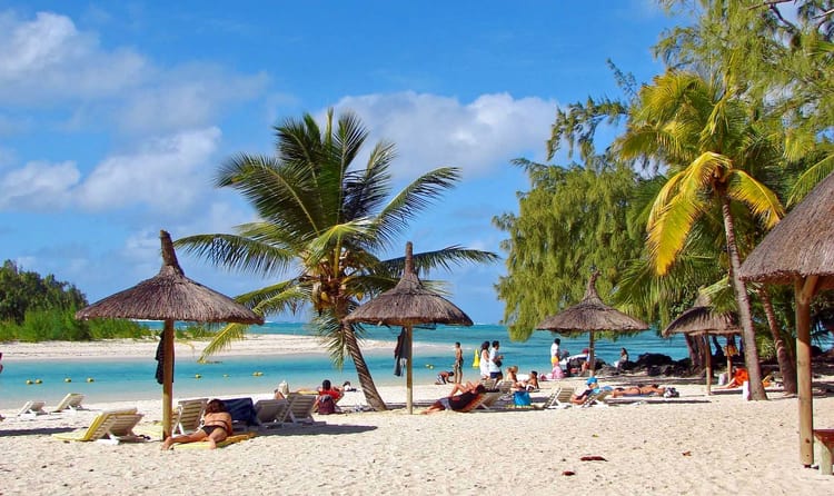 tourists relaxing in diani beach