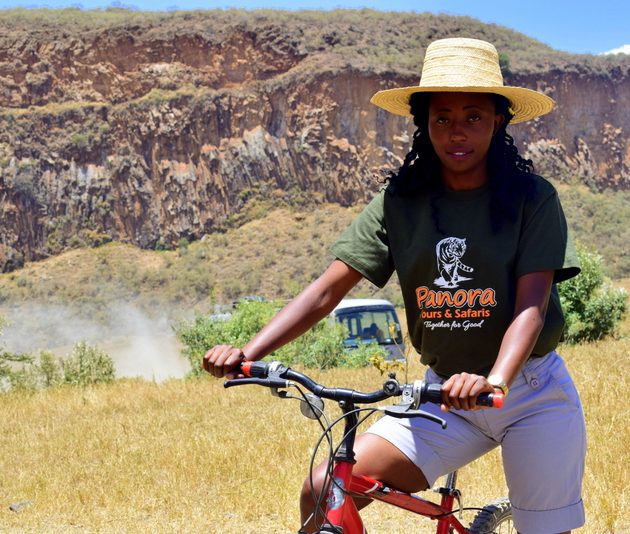 lady cycling in hell's gate national park